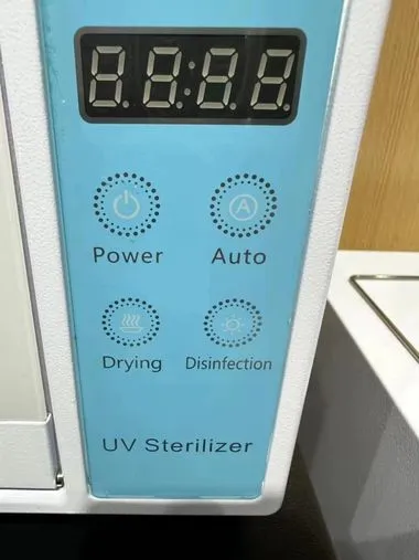 แผงปุ่มสีฟ้า Power / Auto / Drying / Disinfection